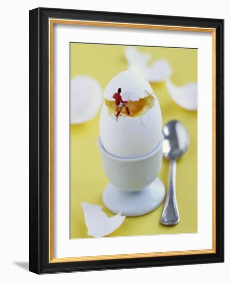 Miniature Footballer Taking the Lid off a Boiled Egg-Martina Schindler-Framed Photographic Print