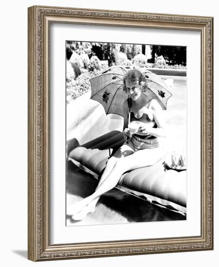 Minna Gombell, Sipping a Cup of Tea Poolside, 1931-null-Framed Photo