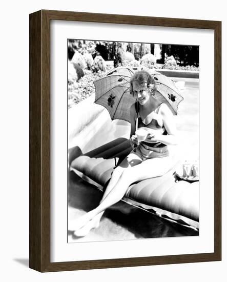 Minna Gombell, Sipping a Cup of Tea Poolside, 1931-null-Framed Photo