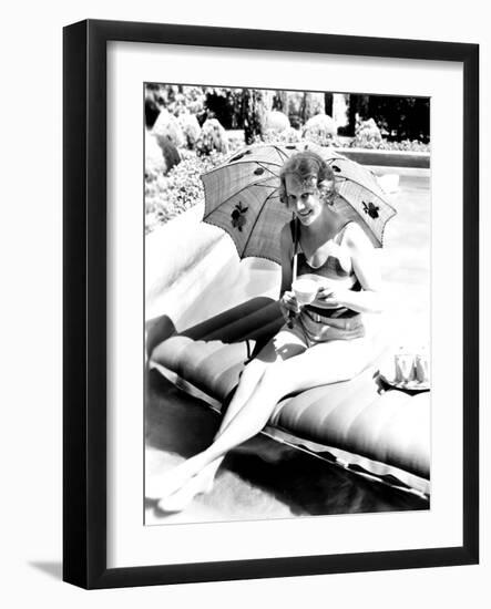 Minna Gombell, Sipping a Cup of Tea Poolside, 1931-null-Framed Photo