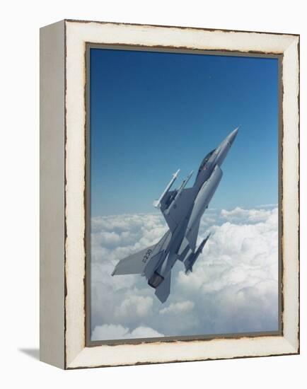 Missile-Armed Us F-16 Fighter Aircraft in Flight, Climbing Above Clouds-null-Framed Premier Image Canvas