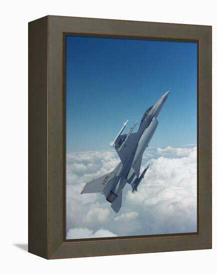 Missile-Armed Us F-16 Fighter Aircraft in Flight, Climbing Above Clouds-null-Framed Premier Image Canvas