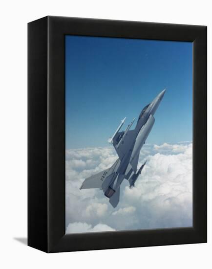 Missile-Armed Us F-16 Fighter Aircraft in Flight, Climbing Above Clouds-null-Framed Premier Image Canvas