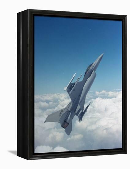 Missile-Armed Us F-16 Fighter Aircraft in Flight, Climbing Above Clouds-null-Framed Premier Image Canvas