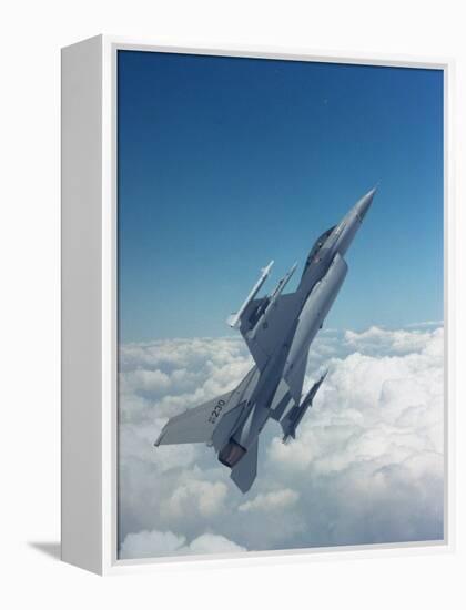 Missile-Armed Us F-16 Fighter Aircraft in Flight, Climbing Above Clouds-null-Framed Premier Image Canvas