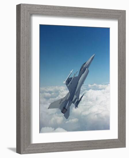 Missile-Armed Us F-16 Fighter Aircraft in Flight, Climbing Above Clouds-null-Framed Photographic Print