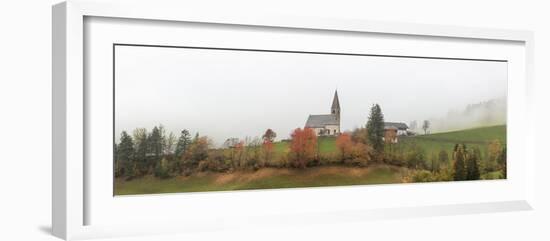 Mist and colourful trees surround the alpine church in the fall, St. Magdalena, Funes Valley, South-Roberto Moiola-Framed Photographic Print