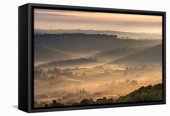 Mist covered rolling countryside at dawn, Dartmoor National Park, Devon, England. Spring (May) 2016-Adam Burton-Framed Premier Image Canvas