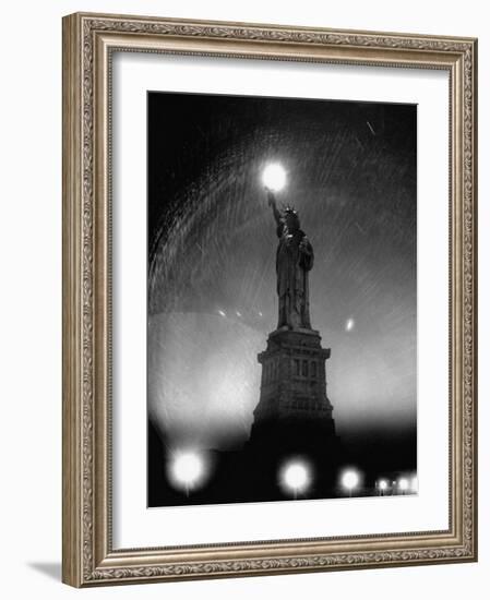 Misty Night Surrounding the Statue of Liberty with Fuzzy Balls of Light from Torch and Lampposts-Andreas Feininger-Framed Photographic Print