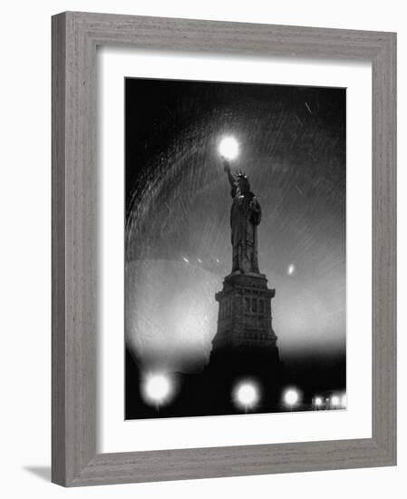 Misty Night Surrounding the Statue of Liberty with Fuzzy Balls of Light from Torch and Lampposts-Andreas Feininger-Framed Photographic Print