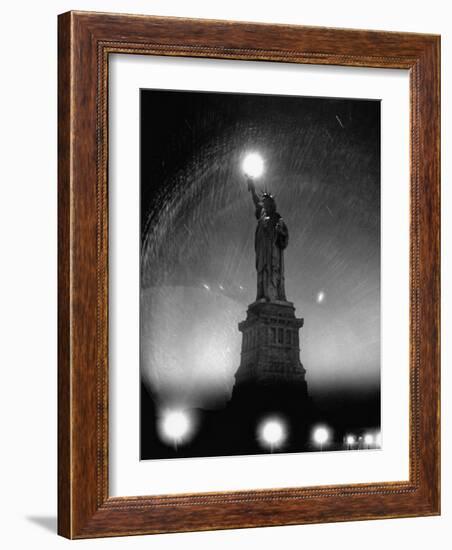 Misty Night Surrounding the Statue of Liberty with Fuzzy Balls of Light from Torch and Lampposts-Andreas Feininger-Framed Photographic Print