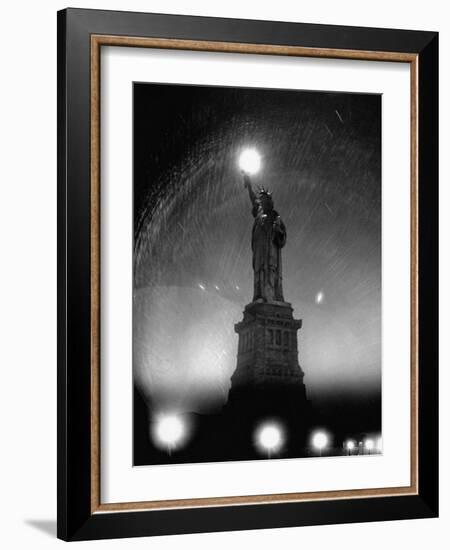 Misty Night Surrounding the Statue of Liberty with Fuzzy Balls of Light from Torch and Lampposts-Andreas Feininger-Framed Photographic Print