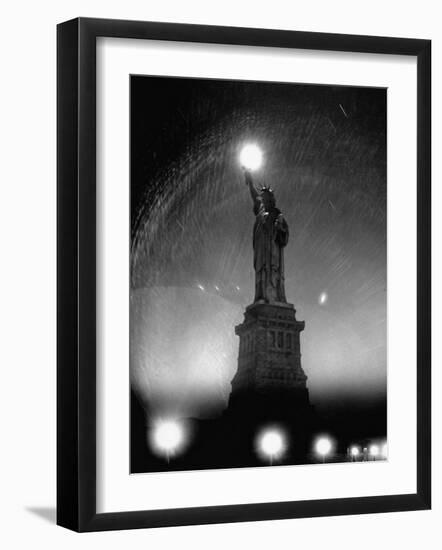 Misty Night Surrounding the Statue of Liberty with Fuzzy Balls of Light from Torch and Lampposts-Andreas Feininger-Framed Photographic Print