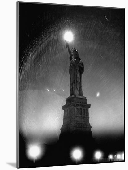 Misty Night Surrounding the Statue of Liberty with Fuzzy Balls of Light from Torch and Lampposts-Andreas Feininger-Mounted Photographic Print