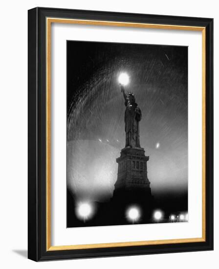 Misty Night Surrounding the Statue of Liberty with Fuzzy Balls of Light from Torch and Lampposts-Andreas Feininger-Framed Photographic Print