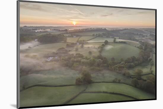 Misty spring sunrise over rolling countryside, South Tawton, Devon, England, United Kingdom, Europe-Adam Burton-Mounted Photographic Print