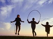 Silhouette of Children Jumping Rope Outdoors-Mitch Diamond-Photographic Print
