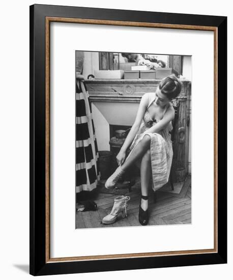 Model Changing Her Shoes For Pierre Balmain's Fashion Show-Nina Leen-Framed Premium Photographic Print