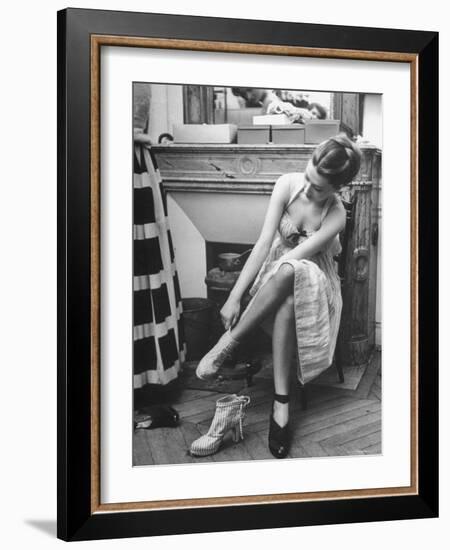 Model Changing Her Shoes For Pierre Balmain's Fashion Show-Nina Leen-Framed Premium Photographic Print