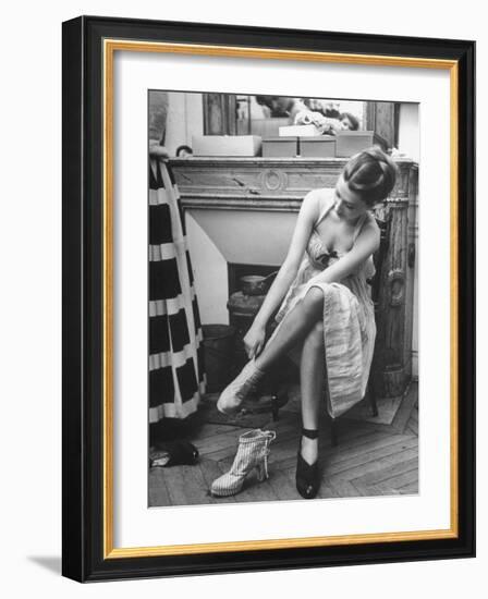 Model Changing Her Shoes For Pierre Balmain's Fashion Show-Nina Leen-Framed Premium Photographic Print