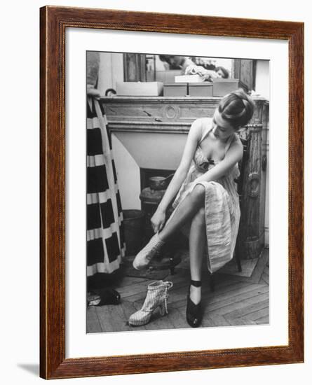 Model Changing Her Shoes For Pierre Balmain's Fashion Show-Nina Leen-Framed Photographic Print