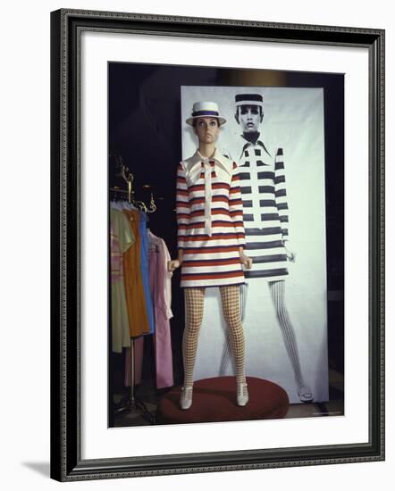 Model Dari Lallou Standing in Front of Poster of Twiggy Wearing Look a Like Outfit-Ralph Crane-Framed Premium Photographic Print