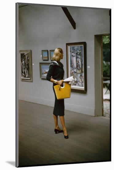 Model in a David Goodstein-Designed Outfit, Looks at Paintings in a Museum, New York, 1954-Nina Leen-Mounted Photographic Print