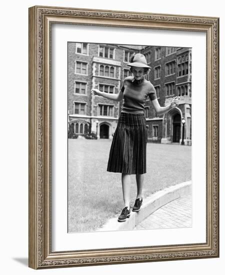 Model in Hat, Sweater and Skirt, Appearing to Balance on Curb, c.1938-Alfred Eisenstaedt-Framed Photographic Print