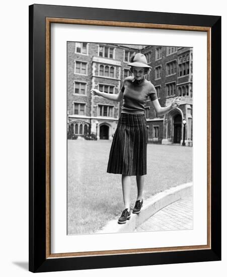 Model in Hat, Sweater and Skirt, Appearing to Balance on Curb, c.1938-Alfred Eisenstaedt-Framed Photographic Print