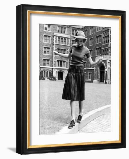 Model in Hat, Sweater and Skirt, Appearing to Balance on Curb, c.1938-Alfred Eisenstaedt-Framed Photographic Print