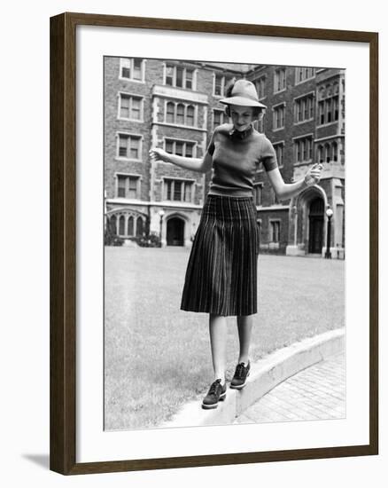 Model in Hat, Sweater and Skirt, Appearing to Balance on Curb, c.1938-Alfred Eisenstaedt-Framed Photographic Print