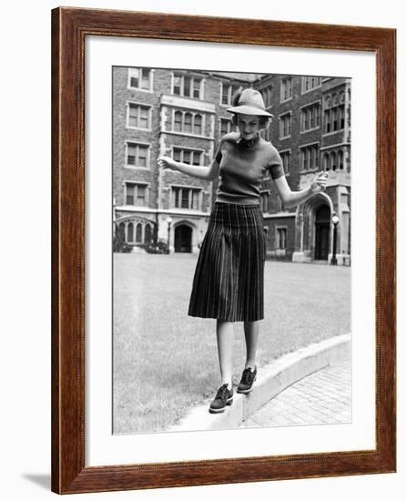 Model in Hat, Sweater and Skirt, Appearing to Balance on Curb, c.1938-Alfred Eisenstaedt-Framed Photographic Print