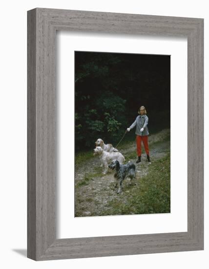 Model in Tom Brigance-Designed Outfit, Walks a Trio of Dogs Along a Path, New York, New York, 1954-Nina Leen-Framed Photographic Print