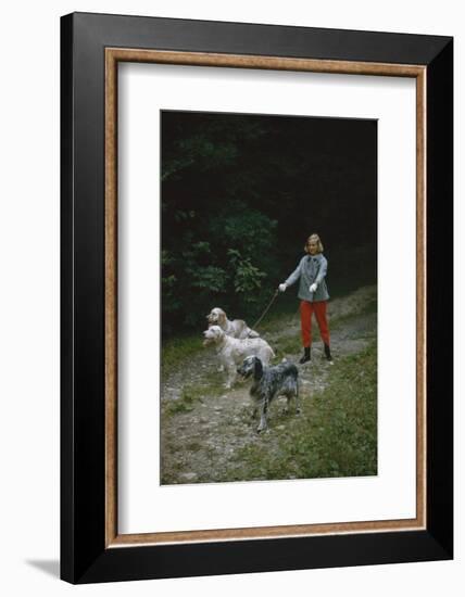 Model in Tom Brigance-Designed Outfit, Walks a Trio of Dogs Along a Path, New York, New York, 1954-Nina Leen-Framed Photographic Print