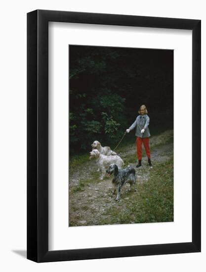 Model in Tom Brigance-Designed Outfit, Walks a Trio of Dogs Along a Path, New York, New York, 1954-Nina Leen-Framed Photographic Print