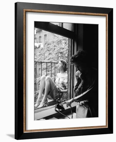 Model Jean Patchet Seated on a Fire Escape, Talks with Eileen Ford, New York, NY, 1948-Nina Leen-Framed Photographic Print