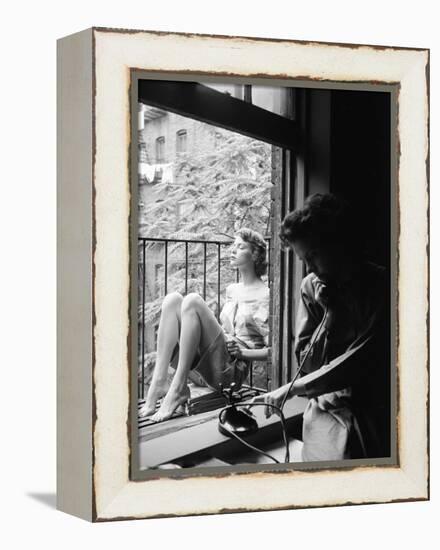 Model Jean Patchet Seated on a Fire Escape, Talks with Eileen Ford, New York, NY, 1948-Nina Leen-Framed Premier Image Canvas