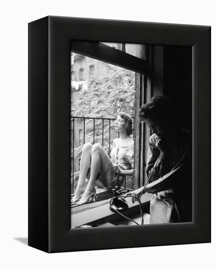 Model Jean Patchet Seated on a Fire Escape, Talks with Eileen Ford, New York, NY, 1948-Nina Leen-Framed Premier Image Canvas