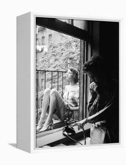 Model Jean Patchet Seated on a Fire Escape, Talks with Eileen Ford, New York, NY, 1948-Nina Leen-Framed Premier Image Canvas