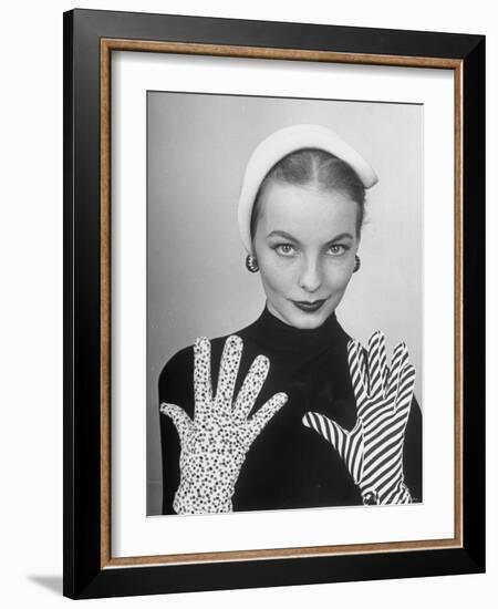 Model Martha Boss, Modeling Mismatched Gloves-Nina Leen-Framed Photographic Print