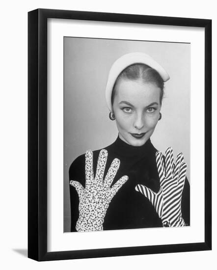 Model Martha Boss, Modeling Mismatched Gloves-Nina Leen-Framed Photographic Print