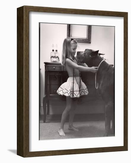 Model Posed Putting Costume Jewelry on Great Dane, Children's Fall Fashion-Nina Leen-Framed Photographic Print