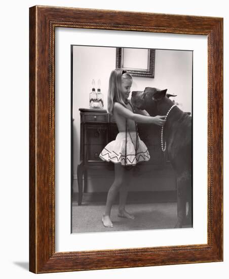 Model Posed Putting Costume Jewelry on Great Dane, Children's Fall Fashion-Nina Leen-Framed Photographic Print