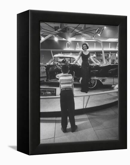 Model Posing Beside Cadillac Eldorado Captures Attention of Young Boy at National Automobile Show-Walter Sanders-Framed Premier Image Canvas