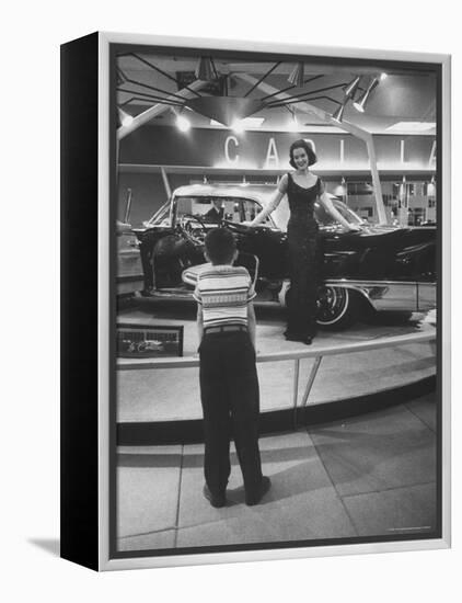 Model Posing Beside Cadillac Eldorado Captures Attention of Young Boy at National Automobile Show-Walter Sanders-Framed Premier Image Canvas