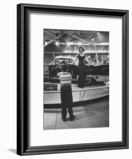 Model Posing Beside Cadillac Eldorado Captures Attention of Young Boy at National Automobile Show-Walter Sanders-Framed Photographic Print