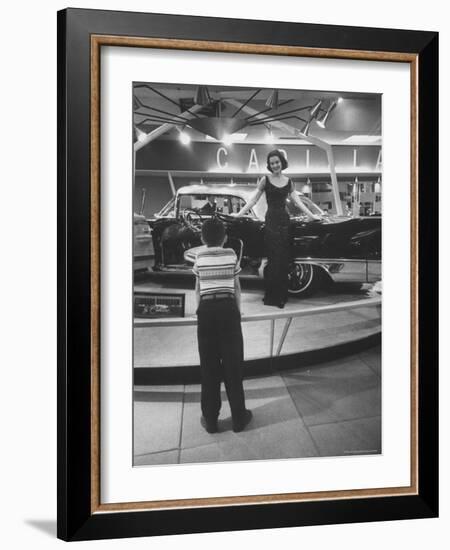 Model Posing Beside Cadillac Eldorado Captures Attention of Young Boy at National Automobile Show-Walter Sanders-Framed Photographic Print