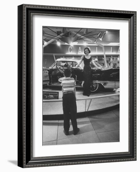 Model Posing Beside Cadillac Eldorado Captures Attention of Young Boy at National Automobile Show-Walter Sanders-Framed Photographic Print