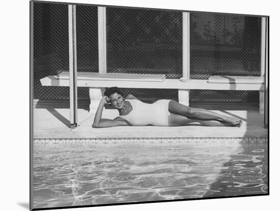 Model Posing Near a Pool-Allan Grant-Mounted Photographic Print