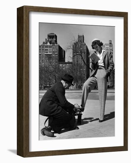 Model Showing Off Slacks as She Reads a First Aid Text Book in Washington Square Park-Nina Leen-Framed Photographic Print